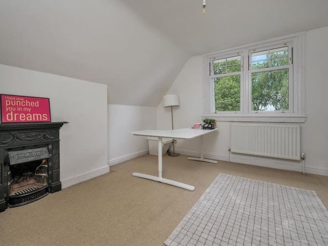 Here is the last of the six bedrooms at Norfolk House. It could be converted into an office if necessary, and features a restored cast-iron fireplace.
