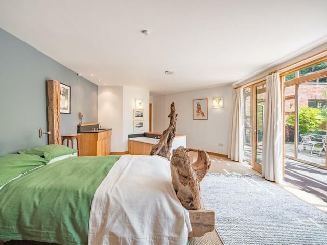 A second photo of the first bedroom, which has easy access to the garden, via the garden room.