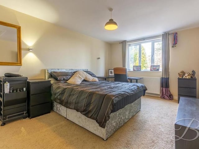 Let's move on to the other three bedrooms at the Lichfield Lane property now. Here's the first of them, oozing comfort, with room for a desk and storage units.