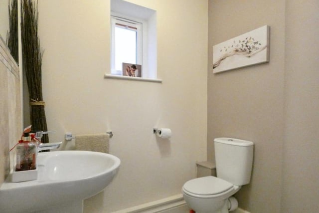 A downstairs toilet is always handy. This one features a low-flush WC and wash hand basin.