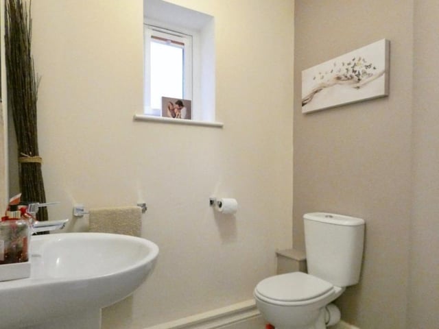 A downstairs toilet is always handy. This one features a low-flush WC and wash hand basin.