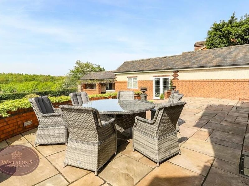 A generously sized patio is the perfect spot to relax in the rear garden during the summer.