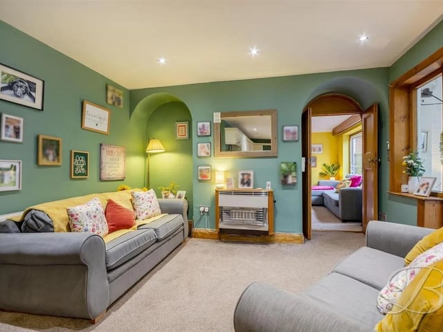 Another reception room offers a cosy place to enjoy family evenings or a separate space for multi-generational living
