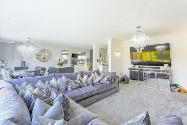 The hub of the home is this vast open-plan living space, which is attached to a kitchen'diner. With its carpeted floor, it oozes luxury and comfort.