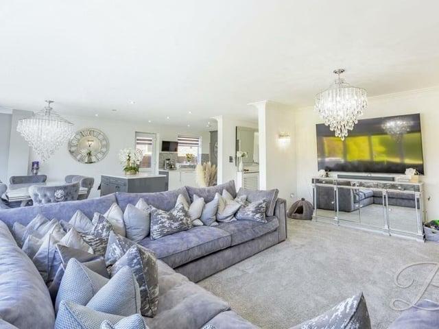 The hub of the home is this vast open-plan living space, which is attached to a kitchen'diner. With its carpeted floor, it oozes luxury and comfort.
