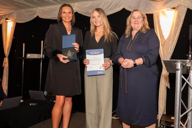 Colleagues from the service receiving the award from Becky Sutton, Chief Operating Officer at Nottinghamshire Healthcare