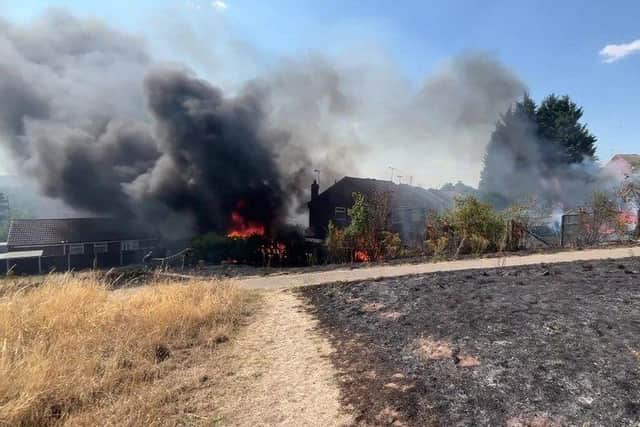 Black smoke billows into the air at the height of Saturday's blaze.