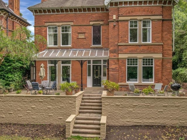 Let's return to the imposing facade of the house now, and a closer look at the front terrace and also the eyecatching veranda canopy, with its restored Victorian posts, that provides a roof for the entrance door.