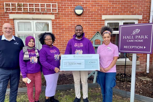 LOCAL CARE HOME PRESENTS CHEQUE TO LOCAL CHARITY