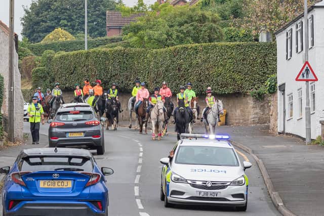 A police escort through Blidworth for the hour-long horse-riders' awareness event. (PHOTO BY: Epona Photography)