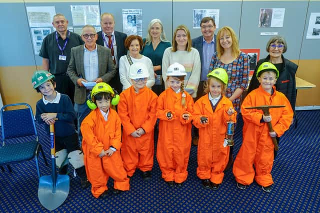 Fundraising launch for the Shining A Light mining sculpture in Mansfield. Organisers, councillors and children from Asquith primary school.