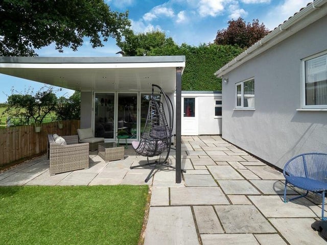 Here's what you've been waiting to see -- the custom-built bar and games room, complete with external covered seating area, offering views of neighbouring farms and countryside. It is ideal for private gatherings..