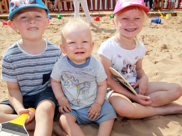 Enjoying the beach are Olivia Owen, five, Samual Owen, and Grace Gibson, five.