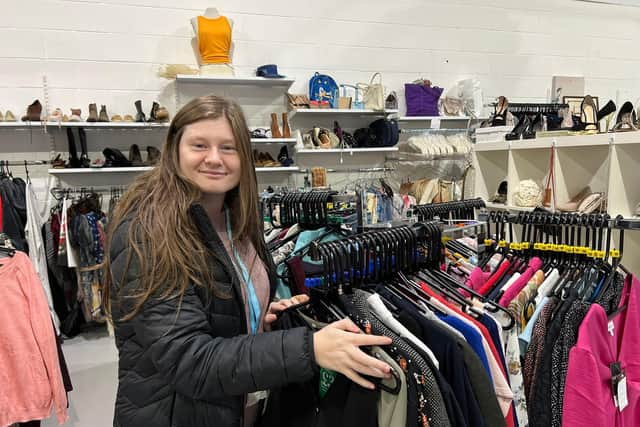 Lacey Olphert at work in the centre’s clothing section.