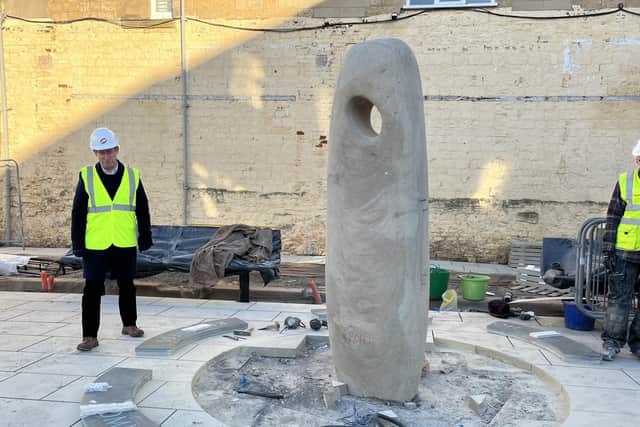 Mayor Andy Abrahams inspects the new sculpture