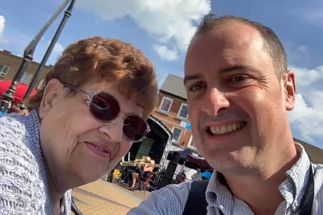 Resident Christine Wakefield, pictured here with Councillor Dave Hennigan in August 2019, who has spoken out about her struggles with her mobility scooter.