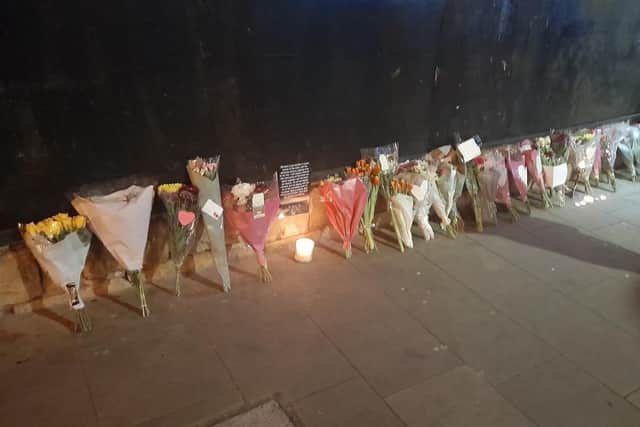Floral tributes to Simon have left at the place he was found on Church Street