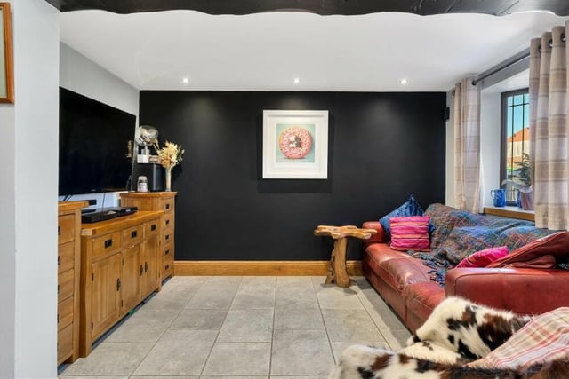 Put your feet up in front of the telly in this cosy and relaxing part of the open-plan family living area in the £250,000 cottage.