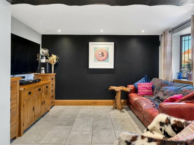 Put your feet up in front of the telly in this cosy and relaxing part of the open-plan family living area in the £250,000 cottage.