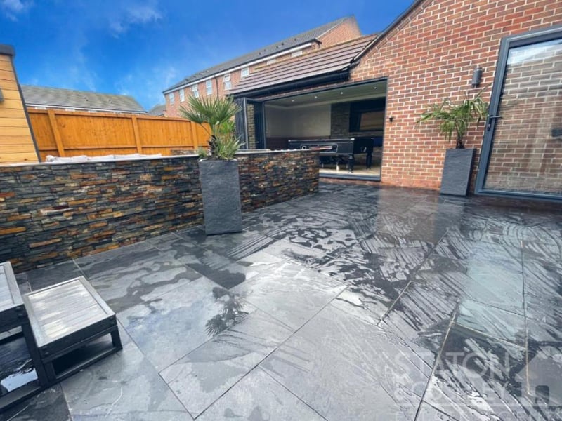 The paved patio-type area outside the kitchen/diner at the Sorrel Drive property.