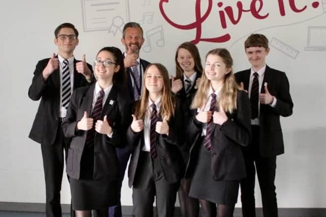 Thumbs up from head teacher Chris Woollard and students at Frederick Gent School in South Normanton after its 'Good' rating from Ofsted.