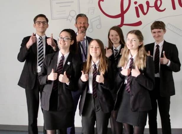 Thumbs up from head teacher Chris Woollard and students at Frederick Gent School in South Normanton after its 'Good' rating from Ofsted.