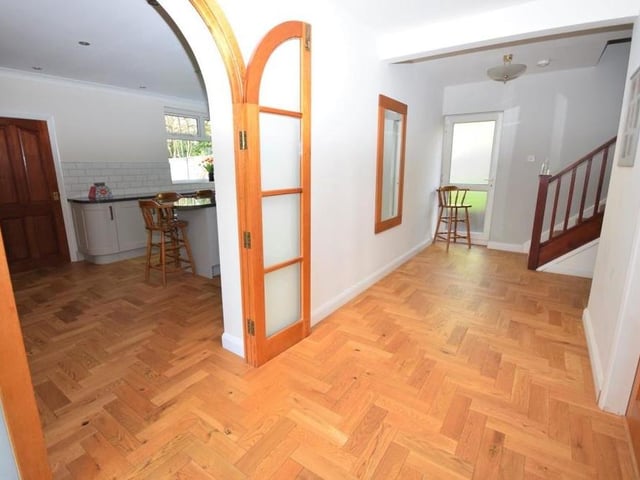 As you step inside the house, a warm welcome is guaranteed thanks to this entrance hall, which offers so much space you could even set up a study area. The floor is solid wood, the stairs lead to four of the six bedrooms, and the area is bathed in natural light from uPVC windows to the side and front.