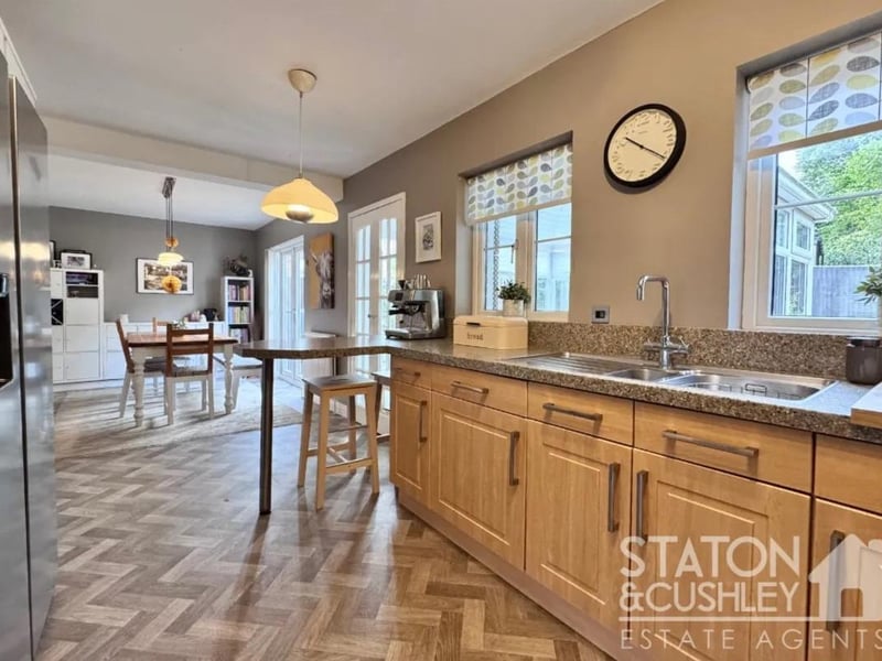 The open plan kitchen/diner is fitted with a range of modern wall and base units, ample over counter work surface and integrated appliances including dishwasher, washing machine, boiling water mixer tap, oven and gas hob.