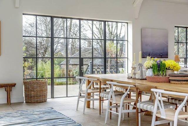 Built for entertaining, this dining room has large windows overlooking the garden.