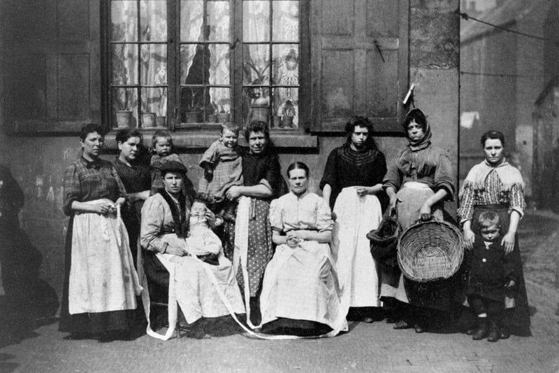 Group of women lace drawers, Knotted Alley, Narrow Marsh, Nottingham, c1890. The women worked in their own homes. During the Industrial Revolution Nottingham's textile industry, particularly lace manufacturing, boomed. The city's rapid growth led to it having some of the worst slums in Britain.