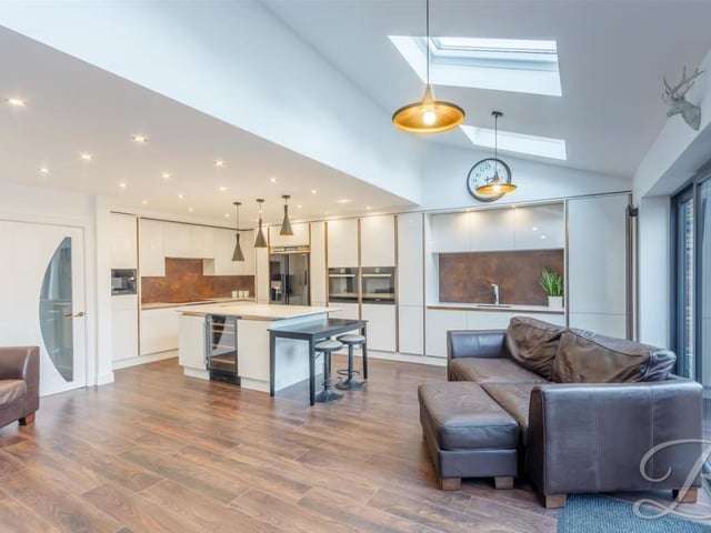A chance to stand back and admire the kitchen, which also has a living area, with space for sofas, while bi-folding doors give access to the garden.