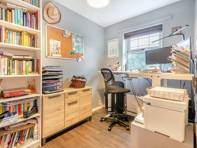 The fourth and final bedroom, which has a vinyl floor and faces the back of the house, could be converted into a home office or study.