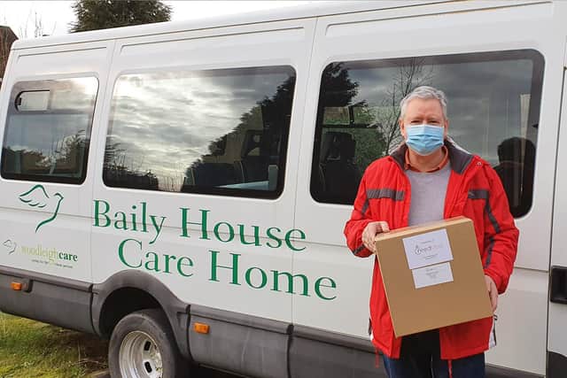 Christopher Hill hands over the masks on Monday