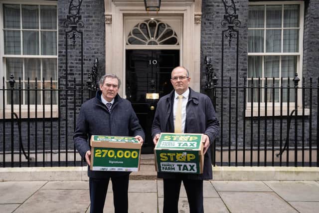 NFU President Tom Bradshaw and NFU Cymru President Aled Jones delivering a petition to Stop The Family Farm Tax to Number 10