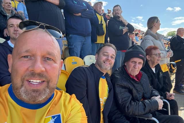 John, his family and Maggie (Deputy Manager at Lowmoor) in the stands enjoying the game.