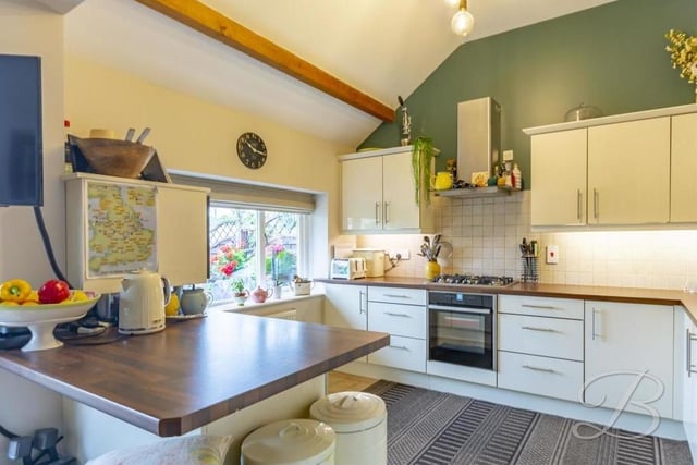The first room we look at on our tour of the Sookholme barn conversion is this stunning kitchen, which comes complete with modern cabinets and work surfaces.