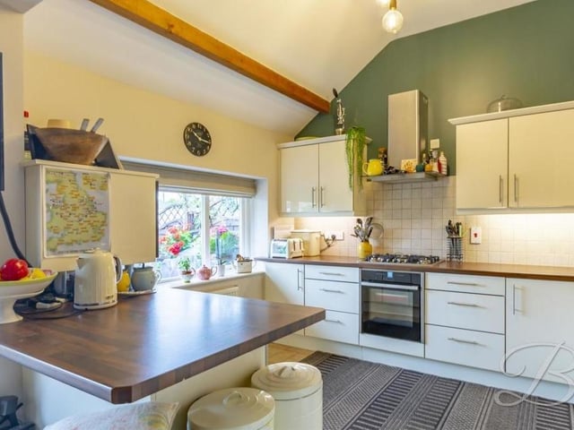 The first room we look at on our tour of the Sookholme barn conversion is this stunning kitchen, which comes complete with modern cabinets and work surfaces.