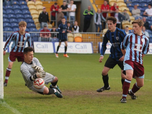 A fine save from Underwood Villa's Reece Dooley.