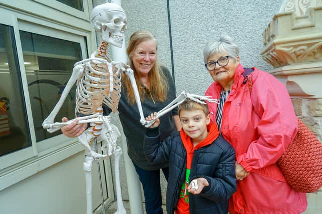 Mansfield Woodhouse Heritage project. Fun with full-size skeleton a box of bones, archaeological dig site. Joyce Bosnjak, Morgan Hunter and Ann Edwards.