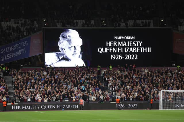 The LED board shows a photo Queen Elizabeth II as players of West Ham United and FCSB observe a minutes silence after it was announced that Queen Elizabeth II has passed away during the UEFA Europa Conference League group B match between West Ham United and FCSB at London Stadium on Thursday, September 8.