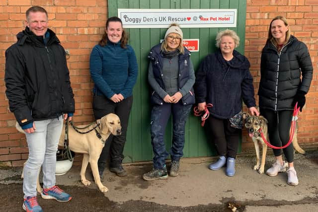 Denise Hardwick pictured alongside Jade Sheldon and Doggy Den's volunteers who had taken some of the dogs on their mid-morning walk.