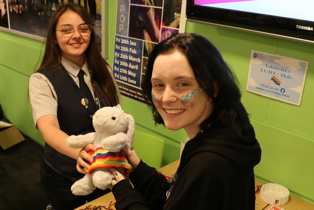 Public services student Ebony Hutton, left, and accounting and business student Paige Gartland with Pride-themed items on sale at the Derby Road campus.
