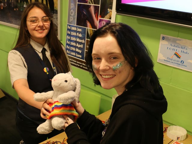Public services student Ebony Hutton, left, and accounting and business student Paige Gartland with Pride-themed items on sale at the Derby Road campus.