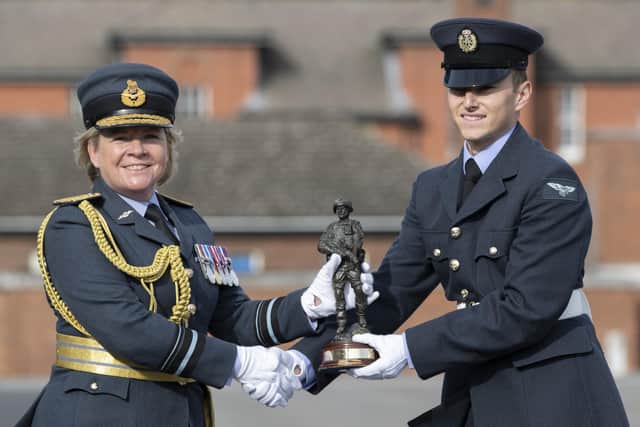 Air Vice Marshal Maria Byford, Chief of Staff Personnel and Air Secretary, presents AR Liam Best with his trophy.