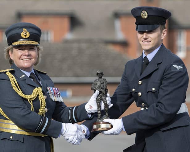 Air Vice Marshal Maria Byford, Chief of Staff Personnel and Air Secretary, presents AR Liam Best with his trophy.