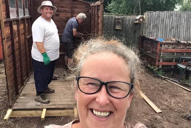 Amanda Fisher with helpers at the community allotment on Northfield Avenue.