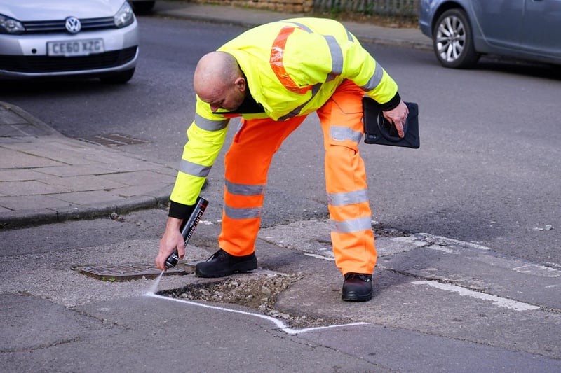 Poyhole repairs. Gary Wright senior highways inspector at the site of a pothole reported by the public in Ashfield.