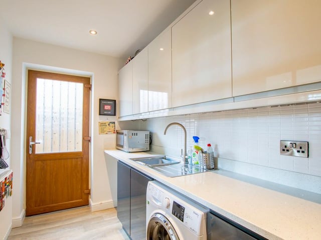 The house has a very useful utility room.