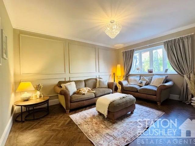 The lounge is a further great sized reception room, complimented with panelled walls, enjoying views of the rear garden.