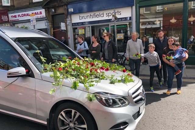 Xander passed through Morningside at around 11:10am and those waiting laid the roses on the bonnet of the car